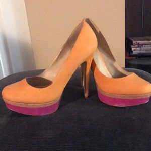 Orange suede pumps